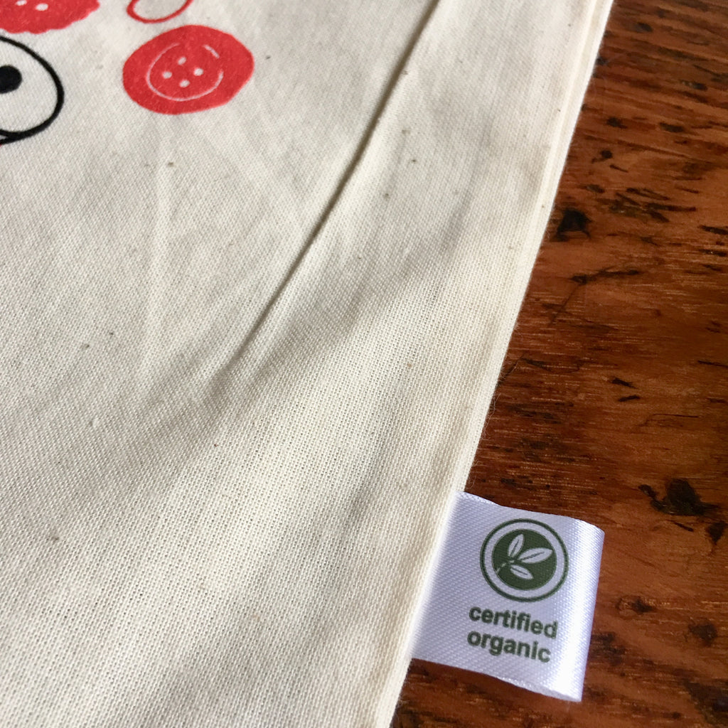 Close up of a tag on a canvas bag that reads "certified organic"