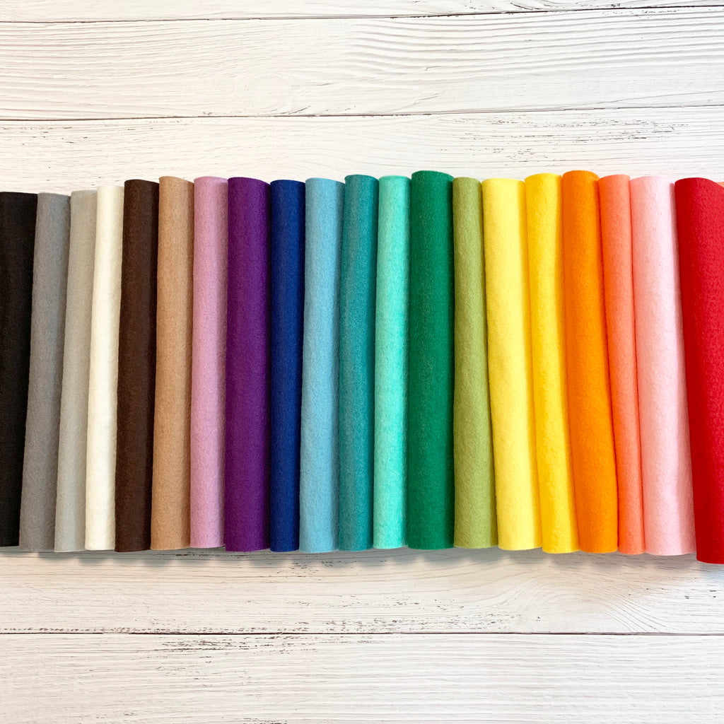 20 sheets of felt lined up in rainbow order