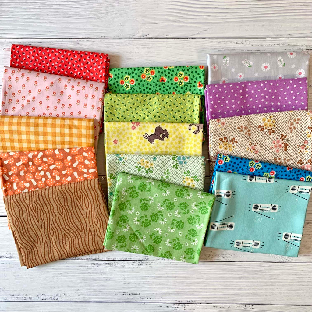 15 Fat Quarters of fabric arranged in a loose grid