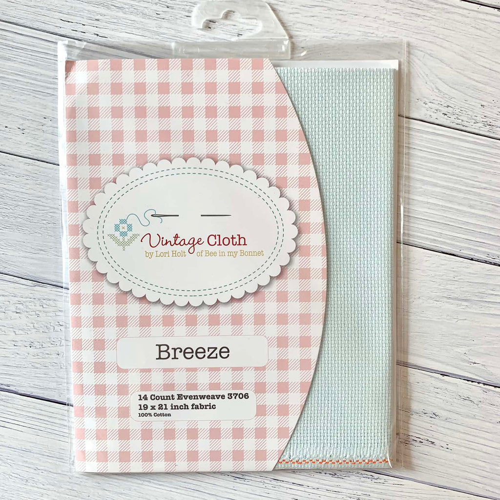 a package of very light blue 14 count cross stitch fabric